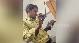 Lab assistant uses YouTube to perform an ECG on a patient in India