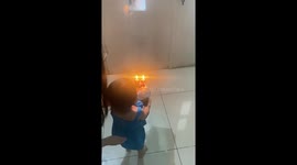 Toddler drops birthday cake during surprise in Bandung