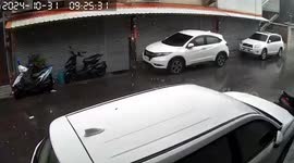 Water tank falls from building's roof onto road below