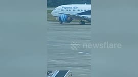 Passengers flee as plane catches fire on runway in Indonesia