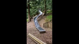 grown woman playing on slide