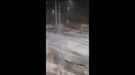 Extreme storm turns road into white water rapids