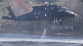US: Massachusetts National Guard’s Blackhawk Helicopters Battle Raging Wildfires with Precision Water Drops