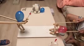 Puppets with balloon heads have pin duel