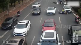 Car Door Suddenly Opens, Knocking Over Passing Electric Scooter—Nearby Vehicle Narrowly Avoids Running Over Rider