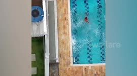 Armed suspect jumps from roof into swimming pool in failed bid to evade arrest