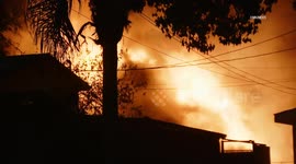 US, Los Angeles: Central Alameda Two Story House Fire
