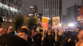 Independent journalist is accosted from protest against Donald Trump at the US Embassy in London after being accused of being far-right.