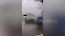 Typhoon Yinxing pummels police station glass door in the Philippines