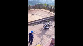 Drones clean insulators of high-voltage towers in SW China