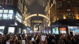 The Carnaby Street Christmas Lights switch on with many people watching the display