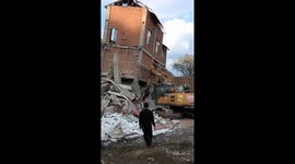 Three-story building collapses near manned tractor in Zhejiang