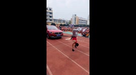 Chinese teacher pulls car while upside down