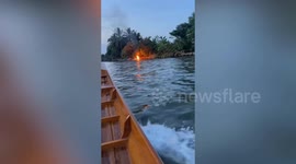 Wooden racing boat catches fire on canal in Thailand