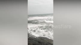 Tea shop owner jumps into raging sea to rescue a drowning man