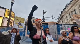 Women strip in Piccadilly Circus standing in solidarity with Iranian student Ahoo Daryaei who was detained by morality police