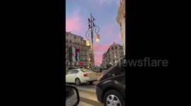 Algeria: Giant Palestinian and Algerian flags adorn a building side by side in Algeria