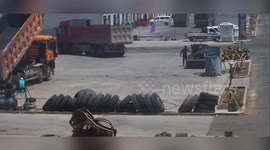 Pedestrian escapes after being run over by dump truck in China