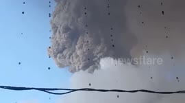 Water mixed with ash drips from roof near volcanic eruption