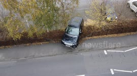 Range Rover stuck on railings after crashing in car park