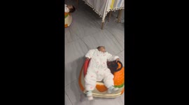 Twin daughters fall asleep on toy cars in Jiangsu Province, China