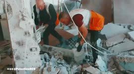 Palestine Red Crescent teams recover the bodies of four individuals following an Israeli strike on a home