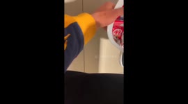 Exclusive-Halloween bathroom bros: Silly lads have candy and vodka exchange in the restroom