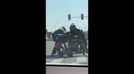 Silent comedy unfolds between delivery riders at red light in China