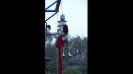 Woman slowly lowered from platform at China's 'bungee jump for cowards'