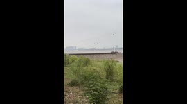 Tidal bore rolls along river in China