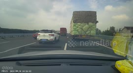 Car shunts vehicle in front on motorway in China