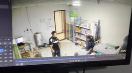 Nurse dances with fists in the air as patient watches in Heilongjiang, China