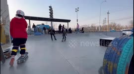 Skater gets stuck on tire obstacle in Beijing