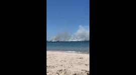 Smoke seen from Sydney Airport as grass fire ignites