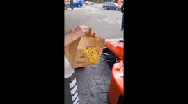 This guy loves F1 so much he collects McDonald's in a Ferrari race car