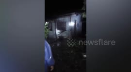 Home collapses into river during Typhoon Toraji in the Philippines