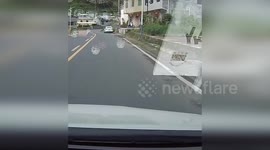 China: Biker Survives Terrifying Head-On Collision with Car on Wrong Side of Shaanxi Road