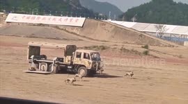 China's military debuts robot 'wolf pack' that are armed with guns
