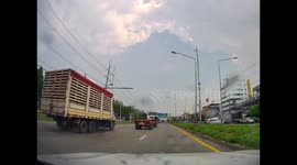Truck skids on wet road surface and crashes into electricity post