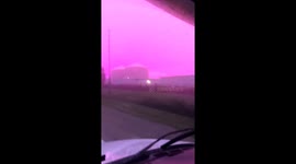 Morning Drive Under Eerie Magenta Sky
