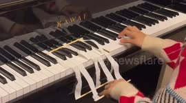 Homemade piano-playing tool unveiled in China
