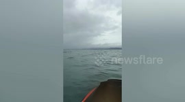 Fisherman and son found clinging to oil drum after boat sinks