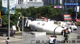 Cement tanker turns over smashing car