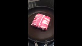Sizzling Bacon wrapped round a cheese sandwich