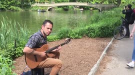 Guy playing Ed Sheeran in central park