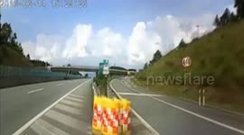 Car crashes anti-bump barrel on motorway