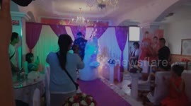 Sparklers set bride's wedding dress on fire during ceremony