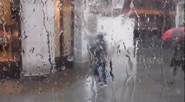 Rain Pours Down In London