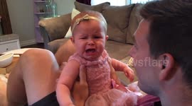 Baby reacts badly to dad shaving his beard