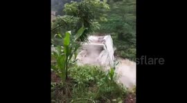 Three-storey house washed away by swollen river